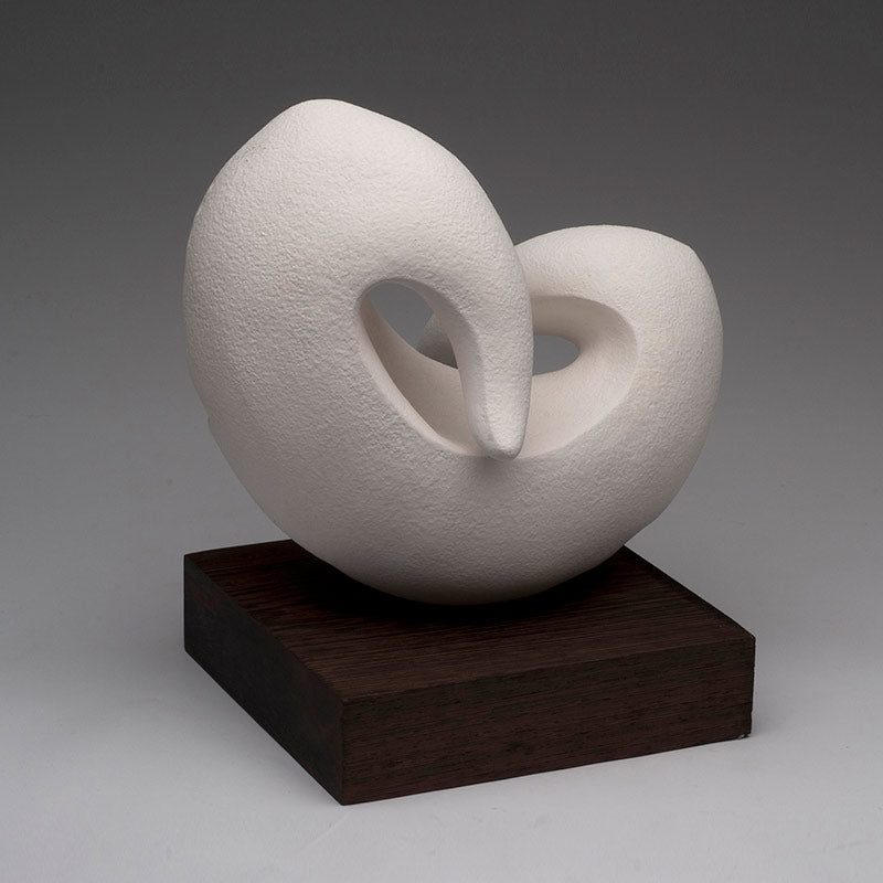 Aneela D ceramic sculpture hand built minimalist style with soft curves and matt surface on wenge wood base