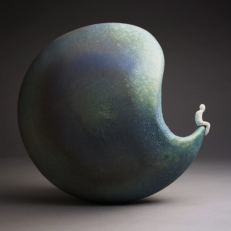 Circular Stoneware hand built blue green ceramic sculpture with little man