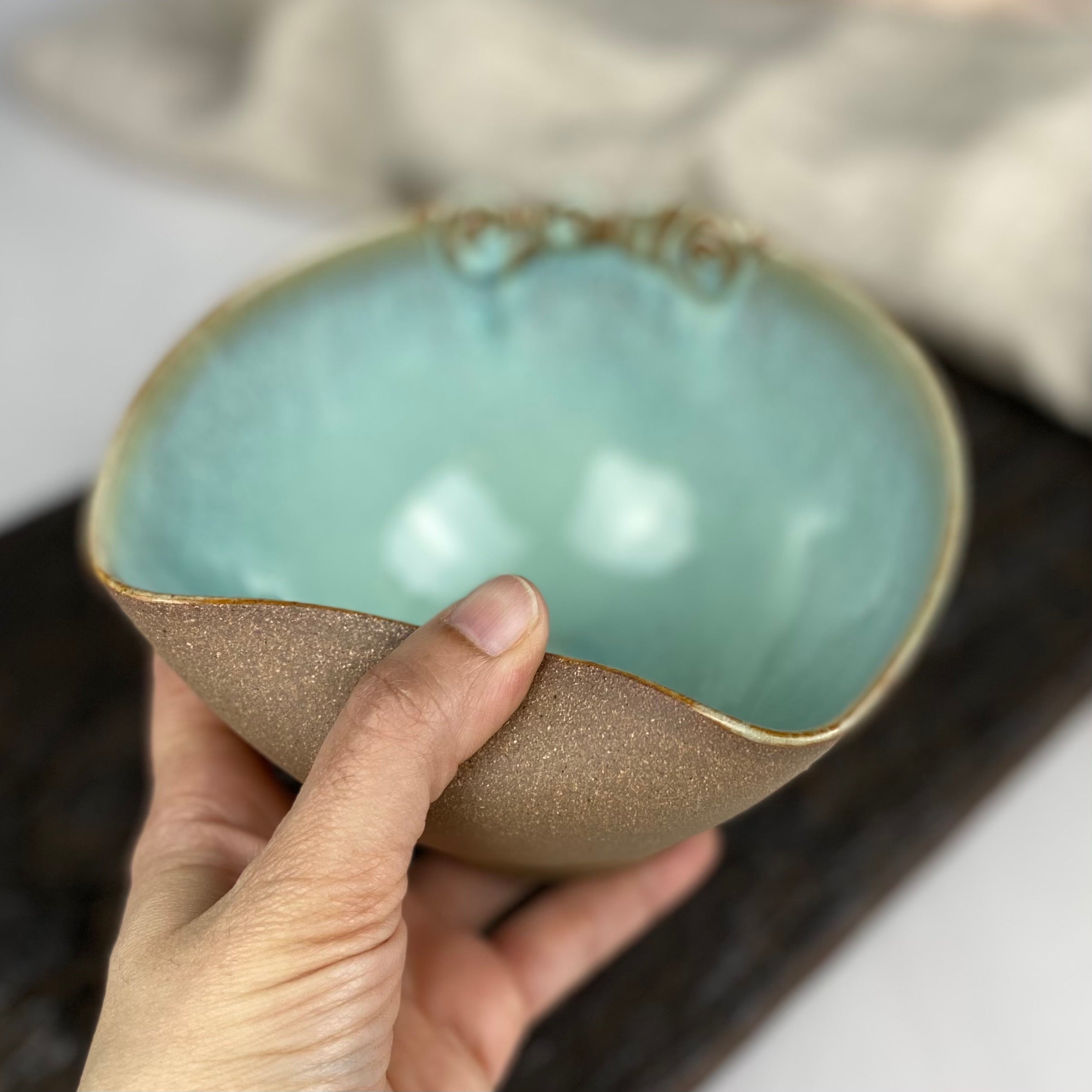 handcrafted pottery bowl with bent rim for snug fit